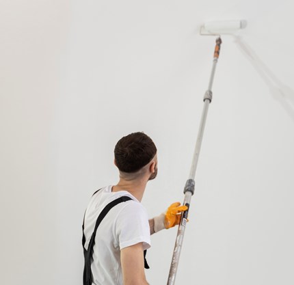 Medium Shot Young Man Painting Wall