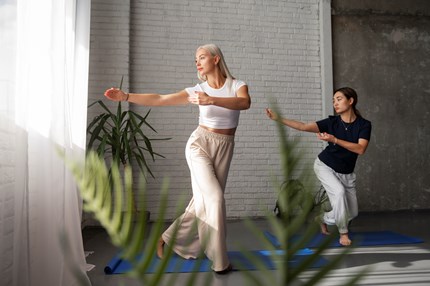 Full Shot Women Practising Tai Chi Together