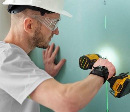 Medium Shot Construction Worker Holding Drill