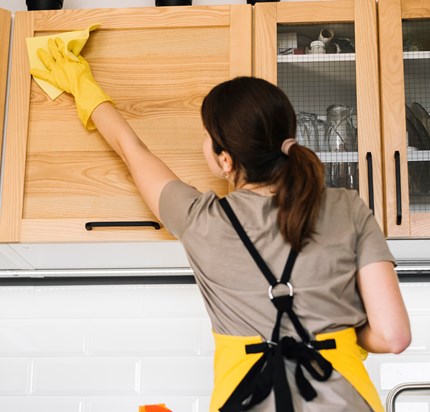 Medium Shot Woman Cleaning Cabinet