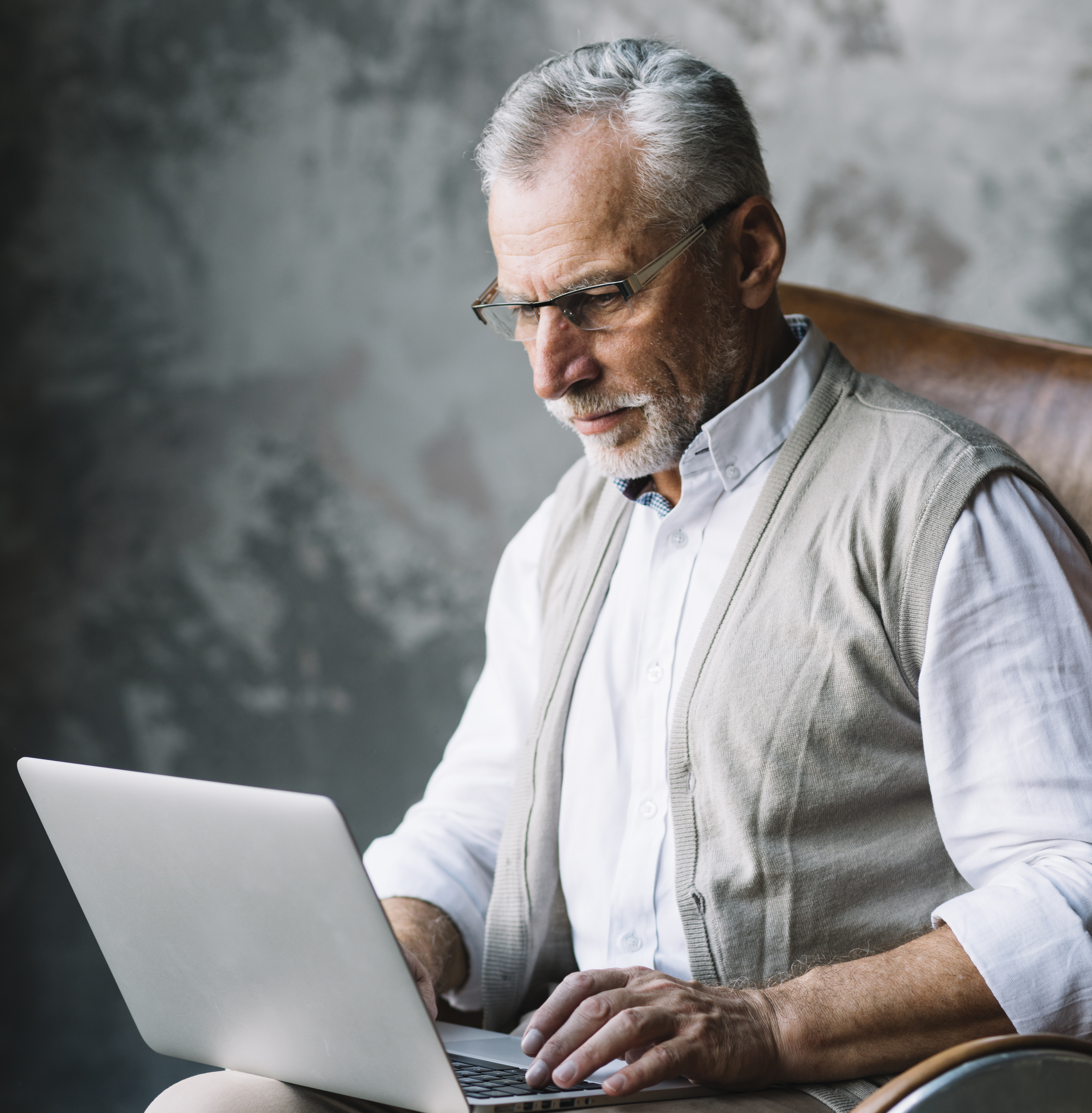 Old Man Sitting Chair Typing Laptop