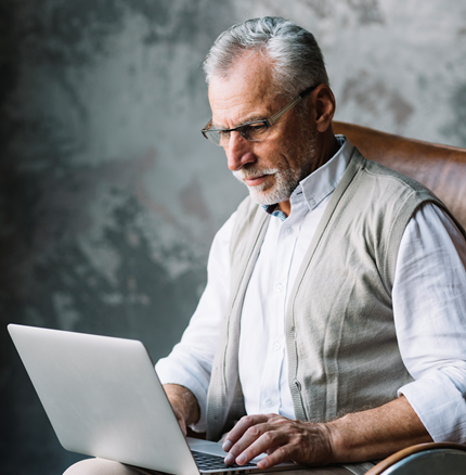 Old Man Sitting Chair Typing Laptop