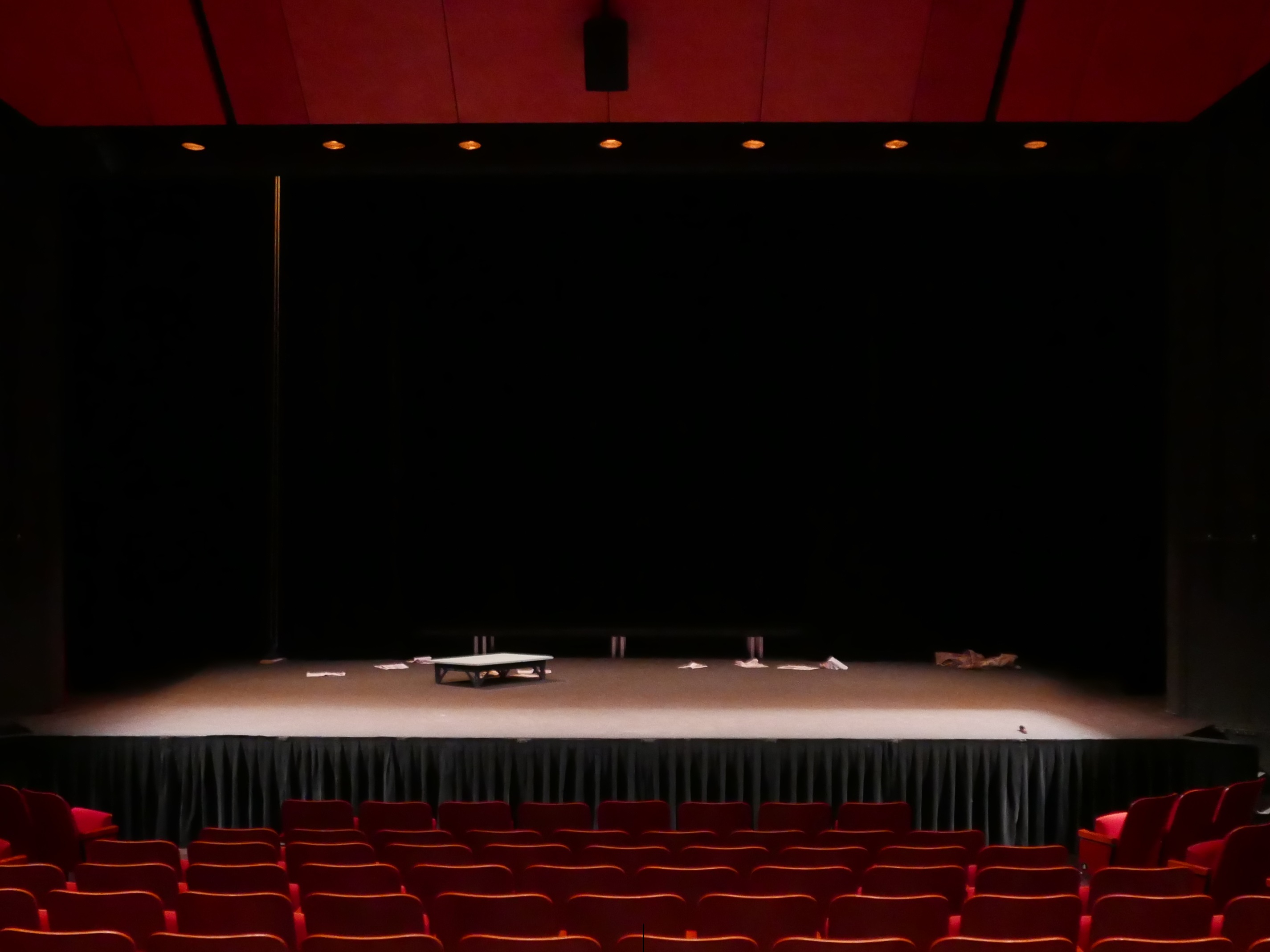 Empty Stage With Few Props Red Seats