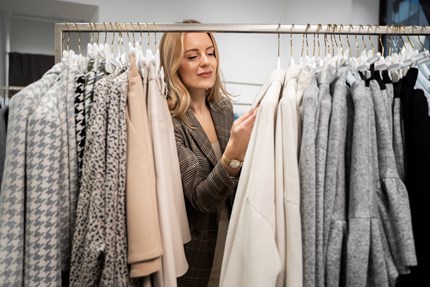 Medium Shot Woman Looking Clothes